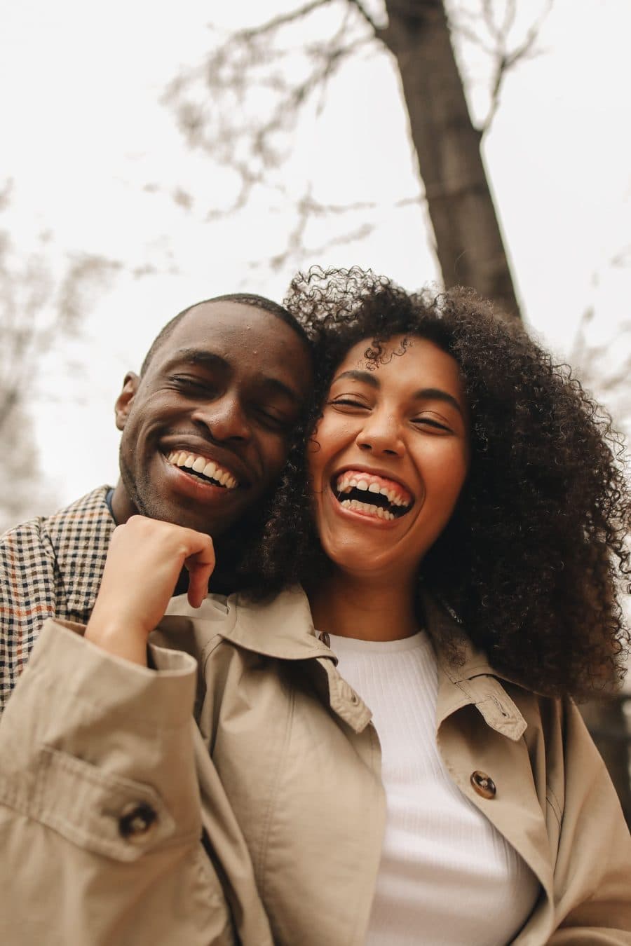 Couple laughing together outdoors